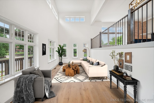 1611 S Lewis Pl, Tulsa, OK 74104 - living area with a towering ceiling and wood finished floors