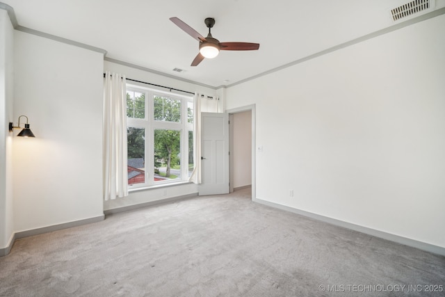 1611 S Lewis Pl, Tulsa, OK 74104 - spare room featuring carpet flooring, ceiling fan, and crown molding