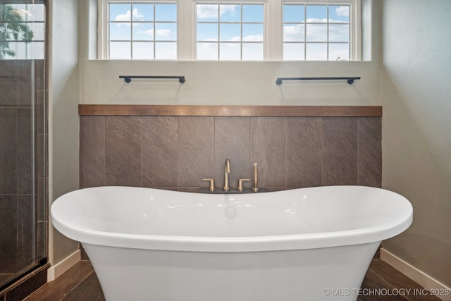 1611 S Lewis Pl, Tulsa, OK 74104 - bathroom with a soaking tub and healthy amount of natural light