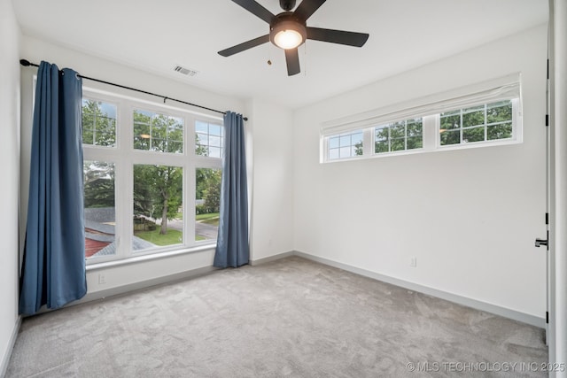 1611 S Lewis Pl, Tulsa, OK 74104 - unfurnished room featuring carpet floors and a ceiling fan