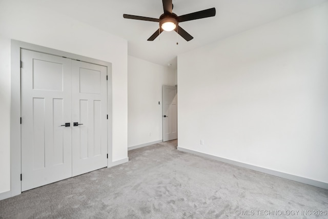 1611 S Lewis Pl, Tulsa, OK 74104 - unfurnished bedroom featuring carpet, a closet, and a ceiling fan