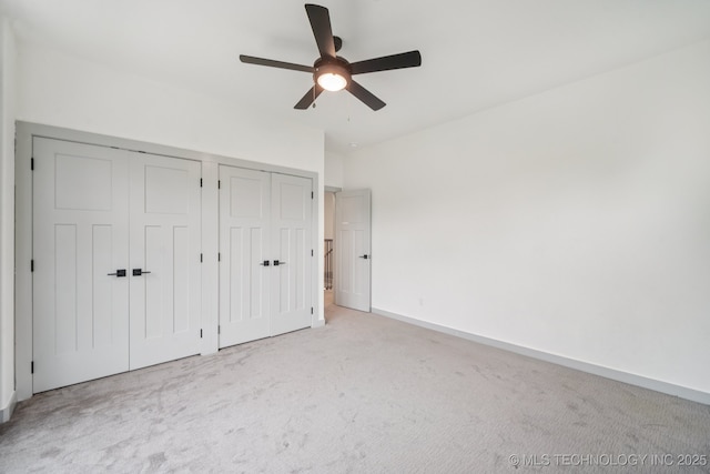 1611 S Lewis Pl, Tulsa, OK 74104 - unfurnished bedroom with light colored carpet, a closet, and ceiling fan