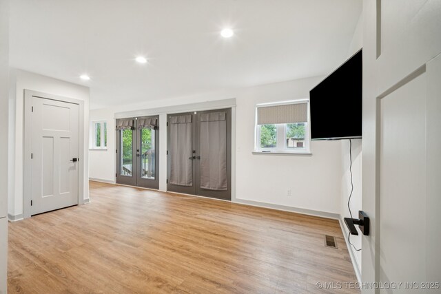 1611 S Lewis Pl, Tulsa, OK 74104 - foyer featuring healthy amount of natural light, french doors, light wood-style floors, and recessed lighting