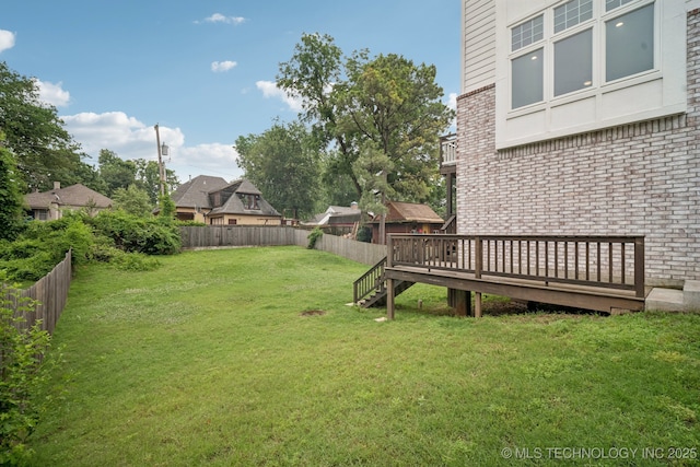 1611 S Lewis Pl, Tulsa, OK 74104 - fenced backyard featuring a wooden deck