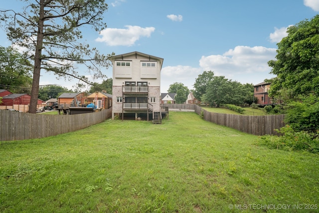 1611 S Lewis Pl, Tulsa, OK 74104 - back of house featuring a fenced backyard, stairway, a sunroom, and a deck