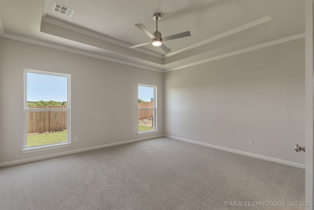 5109 S Everett Dr, Sand Springs, OK 74063 - unfurnished room featuring a raised ceiling, baseboards, carpet flooring, ornamental molding, and a ceiling fan
