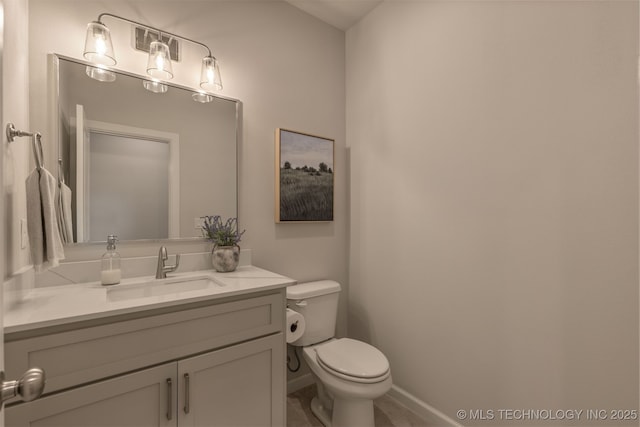 5109 S Everett Dr, Sand Springs, OK 74063 - half bathroom featuring vanity, toilet, and baseboards