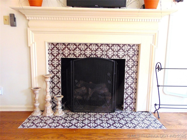 2619 E 47th St, Tulsa, OK 74105 - detailed view of a fireplace, wood finished floors, and baseboards