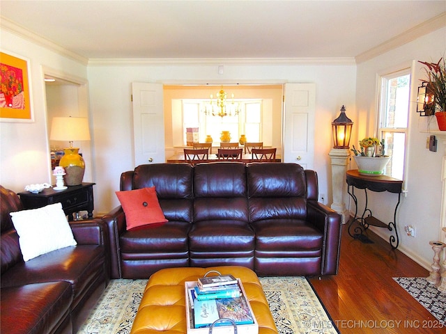 2619 E 47th St, Tulsa, OK 74105 - living room with crown molding, wood finished floors, a chandelier, and baseboards
