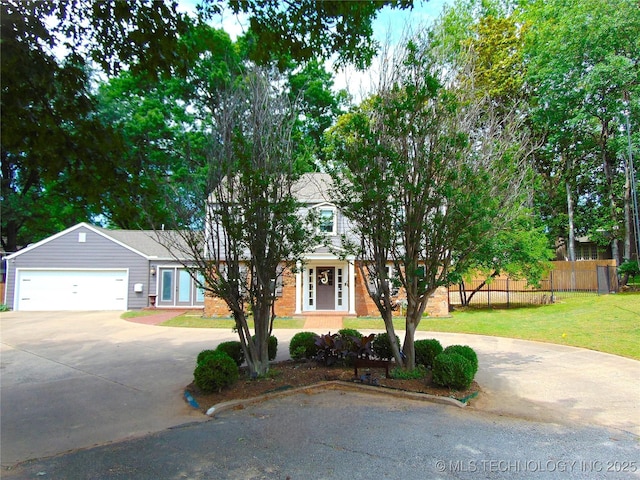 2619 E 47th St, Tulsa, OK 74105 - view of property hidden behind natural elements featuring curved driveway and a garage