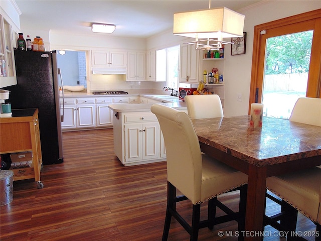 2619 E 47th St, Tulsa, OK 74105 - dining room with dark wood-style floors and a chandelier