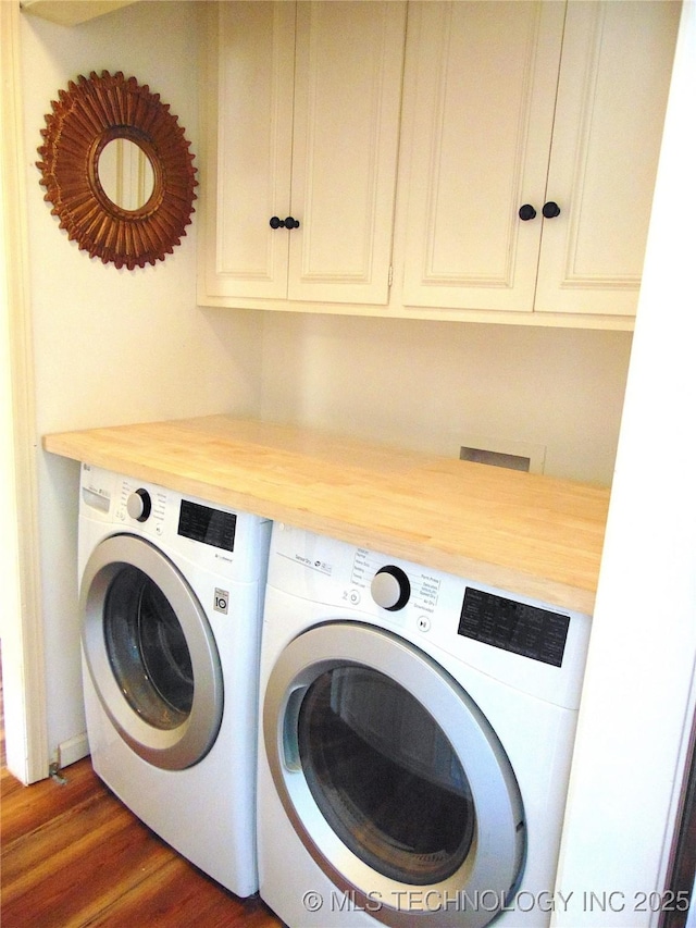 2619 E 47th St, Tulsa, OK 74105 - laundry room featuring washer and clothes dryer, cabinet space, and dark wood-style floors