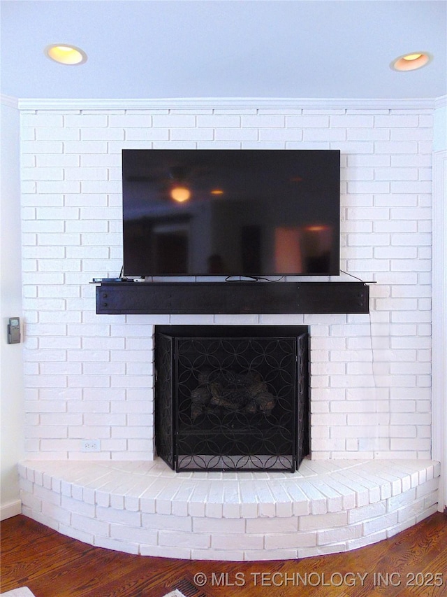 2619 E 47th St, Tulsa, OK 74105 - detailed view of wood finished floors, a brick fireplace, recessed lighting, and baseboards