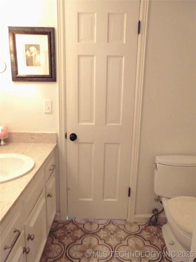 2619 E 47th St, Tulsa, OK 74105 - bathroom with vanity, toilet, and tile patterned floors