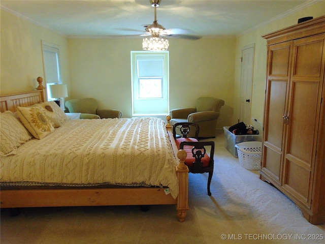 2619 E 47th St, Tulsa, OK 74105 - bedroom with light colored carpet, ornamental molding, and ceiling fan