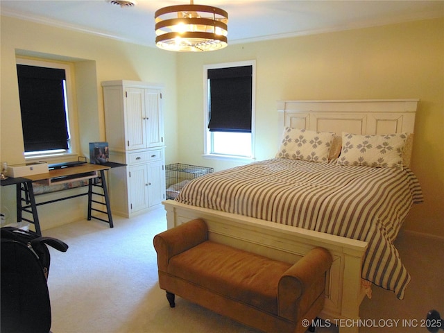 2619 E 47th St, Tulsa, OK 74105 - bedroom with light colored carpet, ornamental molding, and a chandelier