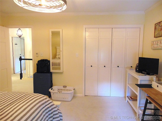 2619 E 47th St, Tulsa, OK 74105 - bedroom featuring ornamental molding, carpet floors, a closet, and baseboards