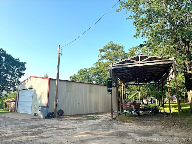 421224 E 1165th Rd, Eufaula, OK 74432 - view of vehicle parking featuring driveway and a detached garage