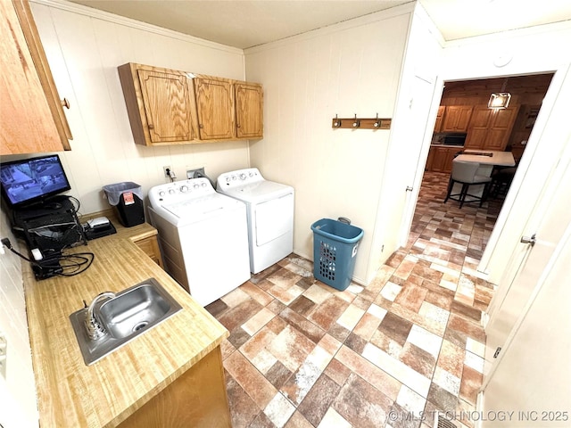 421224 E 1165th Rd, Eufaula, OK 74432 - washroom featuring cabinet space, washer and clothes dryer, and crown molding