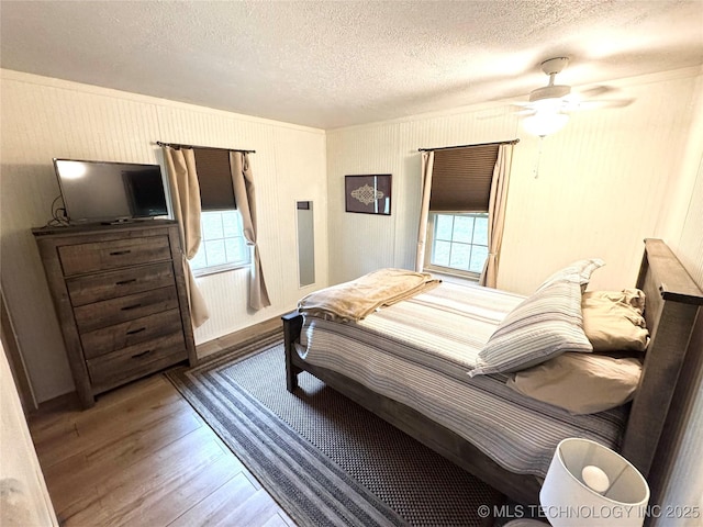 421224 E 1165th Rd, Eufaula, OK 74432 - bedroom featuring a textured ceiling and wood finished floors