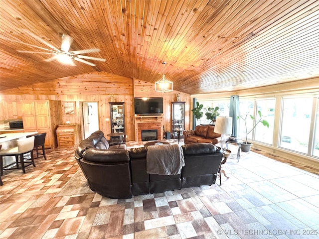 421224 E 1165th Rd, Eufaula, OK 74432 - living room with vaulted ceiling, wood walls, healthy amount of natural light, ceiling fan, and wooden ceiling