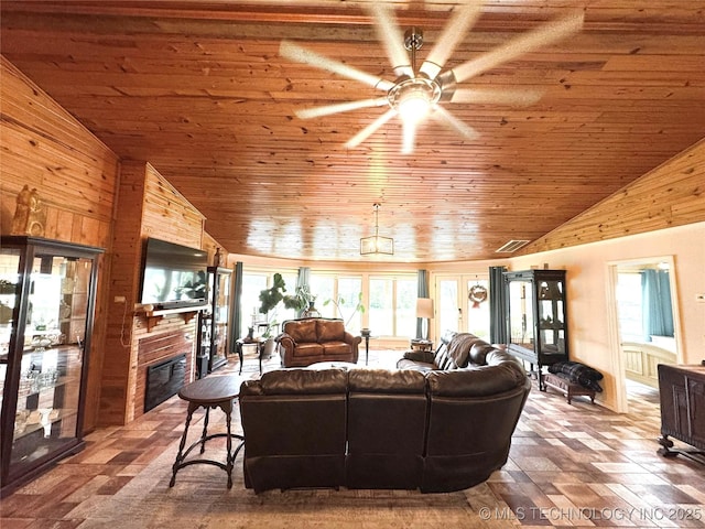 421224 E 1165th Rd, Eufaula, OK 74432 - living room with vaulted ceiling, wooden ceiling, ceiling fan, plenty of natural light, and a glass covered fireplace