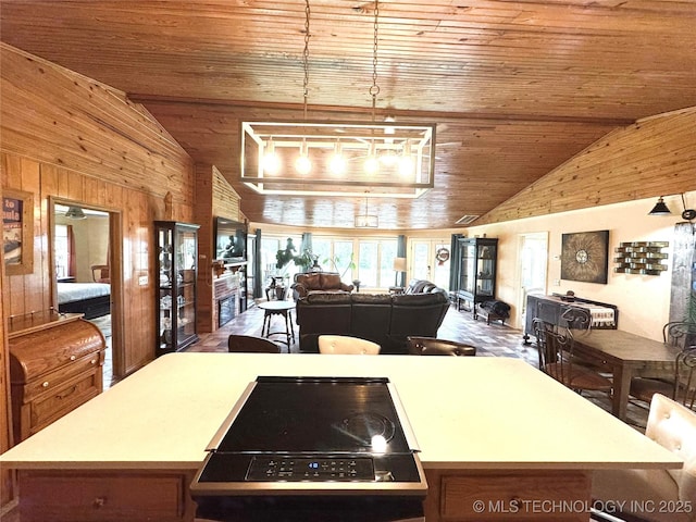 421224 E 1165th Rd, Eufaula, OK 74432 - kitchen with vaulted ceiling, wood ceiling, wood walls, and a center island