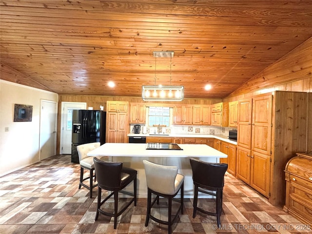 421224 E 1165th Rd, Eufaula, OK 74432 - kitchen featuring a center island, wooden ceiling, light countertops, a kitchen breakfast bar, and black appliances