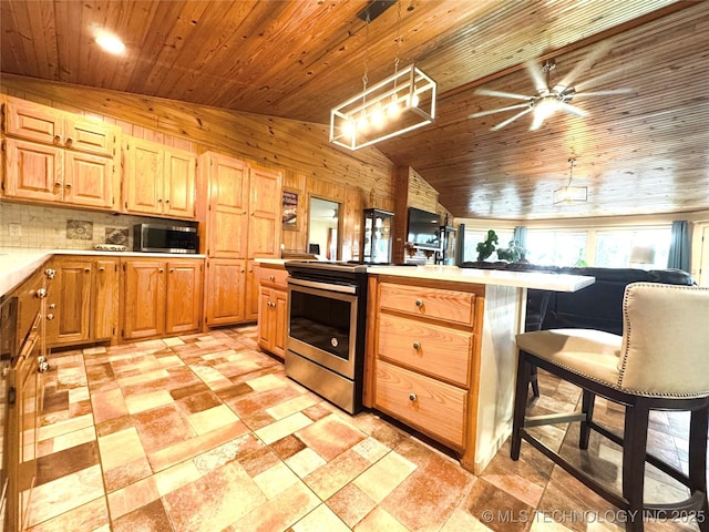 421224 E 1165th Rd, Eufaula, OK 74432 - kitchen featuring stainless steel appliances, vaulted ceiling, ceiling fan, wood ceiling, and light countertops