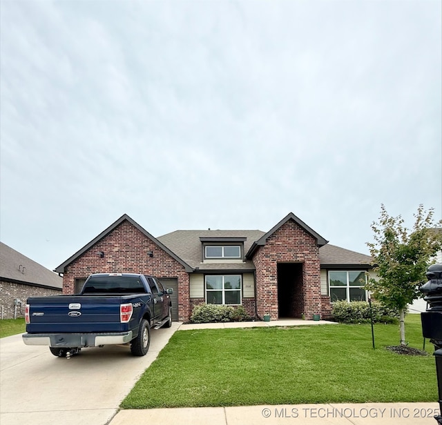 7208 E 154th Pl S, Bixby, OK 74008 - view of front of property with concrete driveway, brick siding, an attached garage, a front yard, and roof with shingles