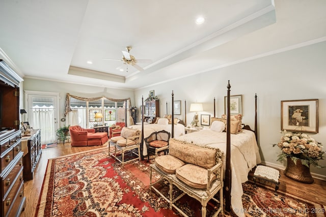 4817 S Yorktown Pl, Tulsa, OK 74105 - bedroom featuring a raised ceiling, wood finished floors, crown molding, access to outside, and recessed lighting