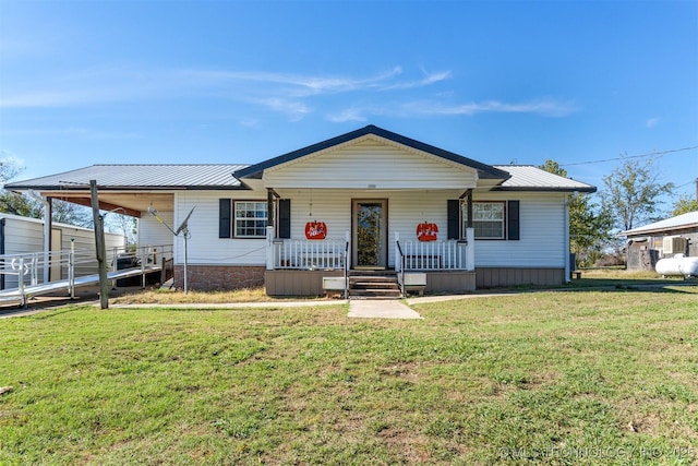 161 N Hickory, Tushka, OK 74525 - view of front facade with a porch, metal roof, and a front yard