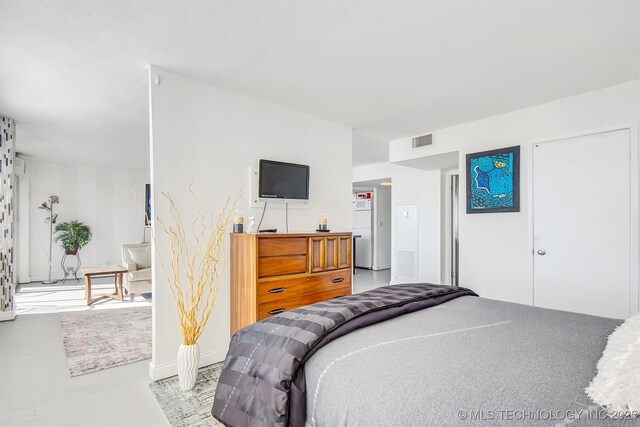 450 W 7th St Unit 1405, Tulsa, OK 74119 - bedroom with finished concrete floors