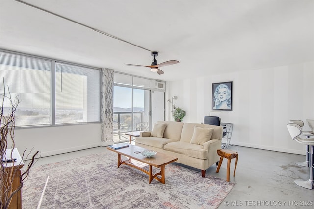 450 W 7th St Unit 1405, Tulsa, OK 74119 - living area with ceiling fan, baseboards, and concrete floors