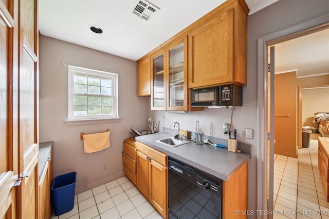 1525 N College Ave, Tulsa, OK 74110 - kitchen featuring black appliances, light tile patterned flooring, glass insert cabinets, and a sink