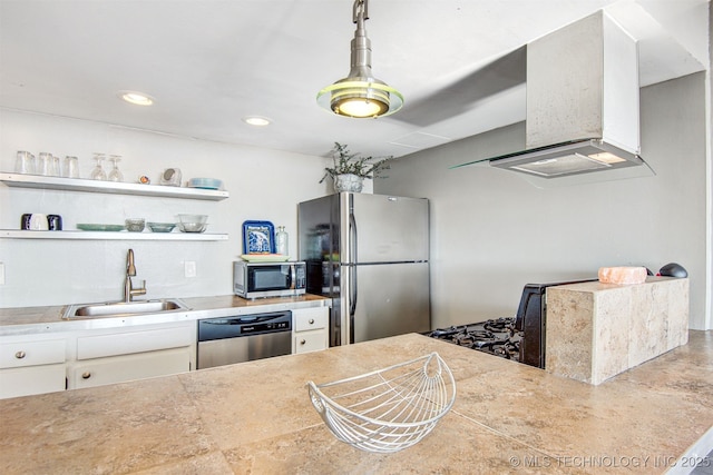 410 W 7th St Unit 1029, Tulsa, OK 74119 - kitchen with stainless steel appliances, a sink, wall chimney exhaust hood, white cabinetry, and recessed lighting
