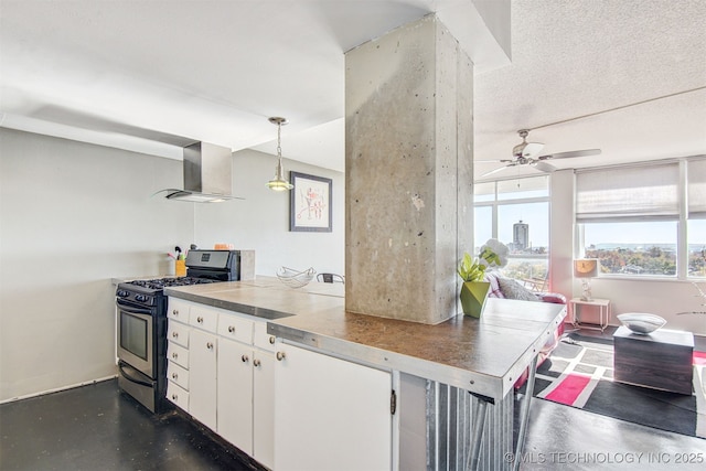 410 W 7th St Unit 1029, Tulsa, OK 74119 - kitchen featuring stainless steel gas range oven, wall chimney exhaust hood, plenty of natural light, and white cabinetry