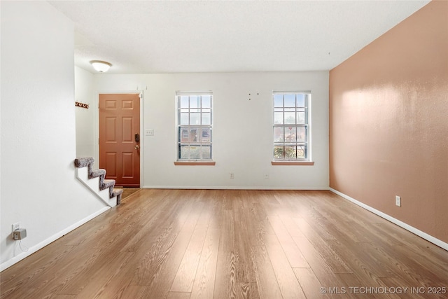 5342 E 47th Pl S Unit 1, Tulsa, OK 74135 - empty room featuring wood finished floors, stairs, and baseboards