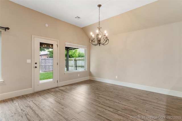 4675 E 144th Pl S, Bixby, OK 74008 - spare room featuring wood finished floors, a chandelier, lofted ceiling, and baseboards