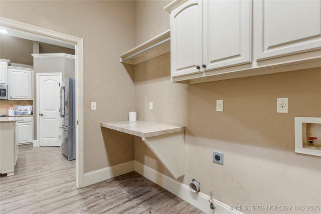 4675 E 144th Pl S, Bixby, OK 74008 - washroom featuring electric dryer hookup, gas dryer hookup, light wood-style flooring, and baseboards