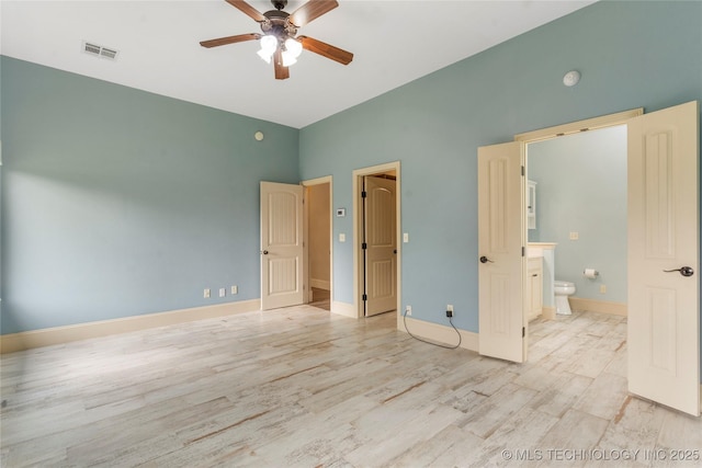 4675 E 144th Pl S, Bixby, OK 74008 - unfurnished bedroom with light wood finished floors, ensuite bathroom, baseboards, and high vaulted ceiling