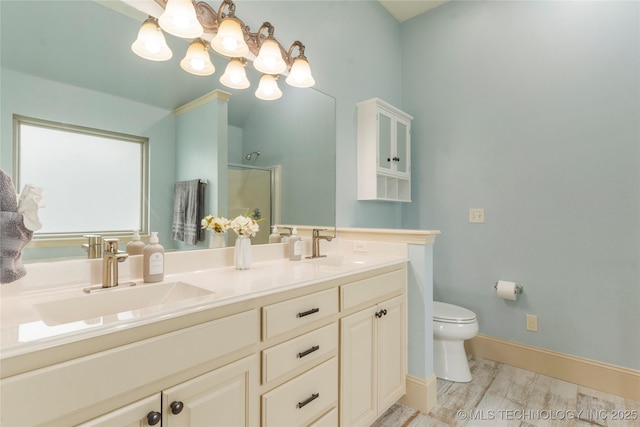 4675 E 144th Pl S, Bixby, OK 74008 - full bathroom featuring double vanity, toilet, a shower with door, wood finished floors, and baseboards