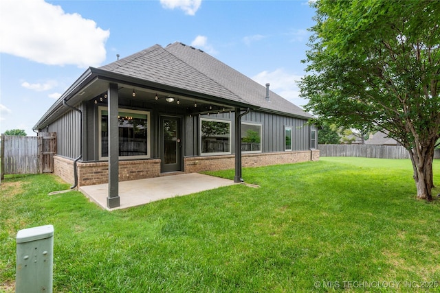 4675 E 144th Pl S, Bixby, OK 74008 - back of house with roof with shingles, brick siding, a patio, and board and batten siding