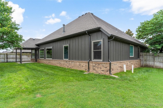 4675 E 144th Pl S, Bixby, OK 74008 - back of property with brick siding, a shingled roof, and board and batten siding