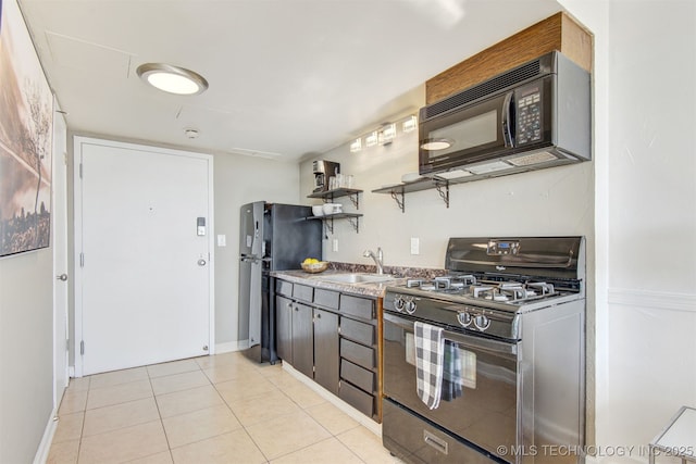 410 W 7th St Unit 1230, Tulsa, OK 74119 - kitchen with black appliances, a sink, open shelves, light tile patterned flooring, and baseboards