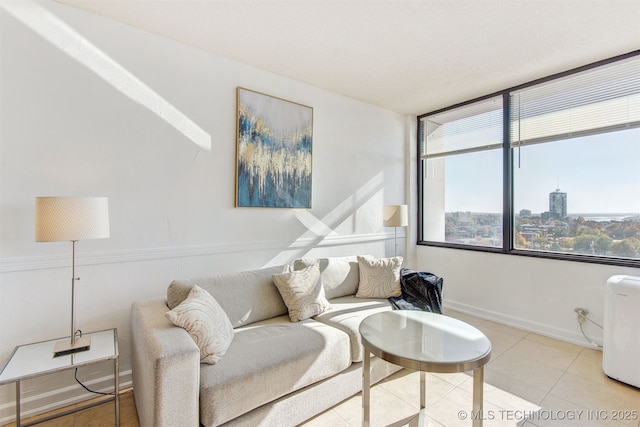 410 W 7th St Unit 1230, Tulsa, OK 74119 - living room with tile patterned floors and baseboards