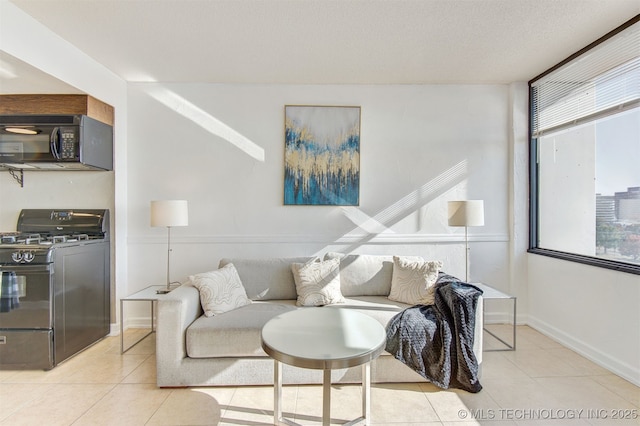 410 W 7th St Unit 1230, Tulsa, OK 74119 - living room with light tile patterned floors and baseboards