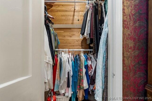 2403 S Troost Ave, Tulsa, OK 74114 - walk in closet with wood finished floors