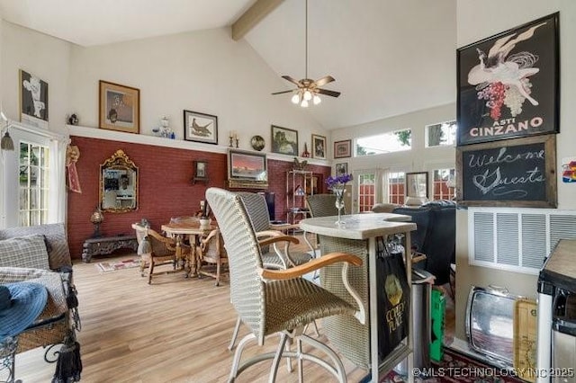 2403 S Troost Ave, Tulsa, OK 74114 - dining area with high vaulted ceiling, ceiling fan, wood finished floors, and beamed ceiling