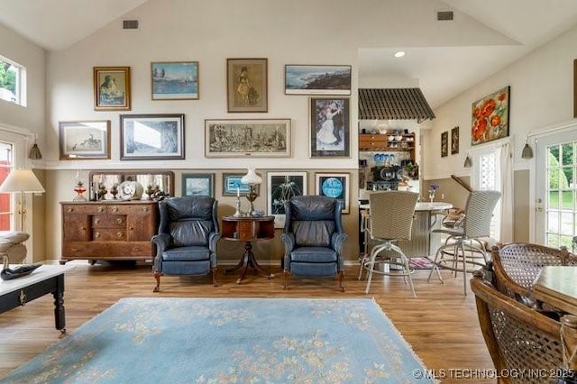 2403 S Troost Ave, Tulsa, OK 74114 - sitting room with plenty of natural light, wood finished floors, recessed lighting, and high vaulted ceiling